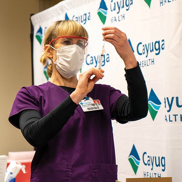 Cayuga Health nurse administering vaccine